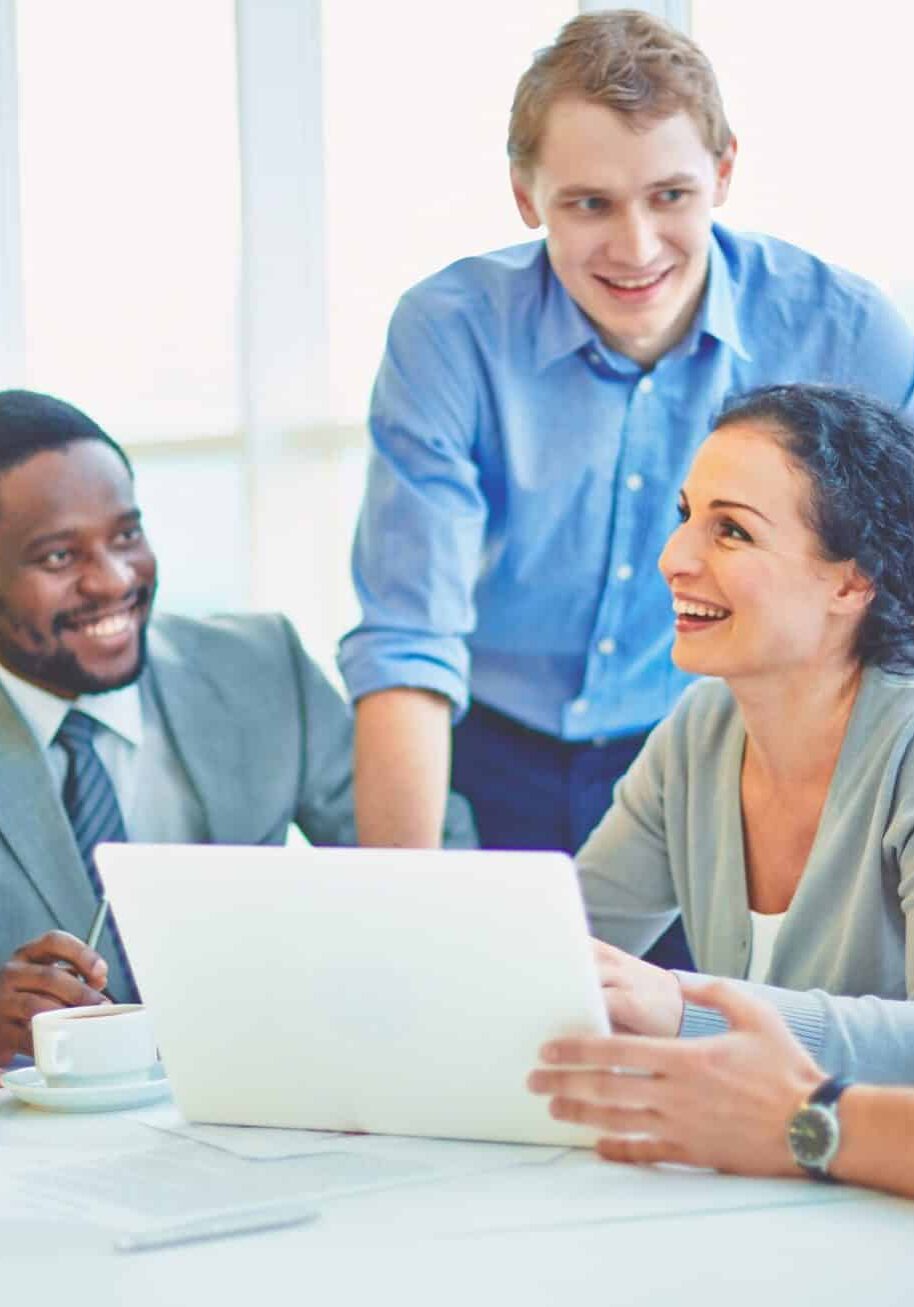 Group of business partners looking at smiling female explaining her ideas at meeting